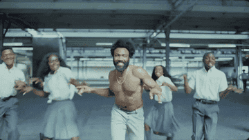 Donald Glover dances shirtless in "This Is America" music video.