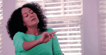 woman putting up her hand to block thoughts out