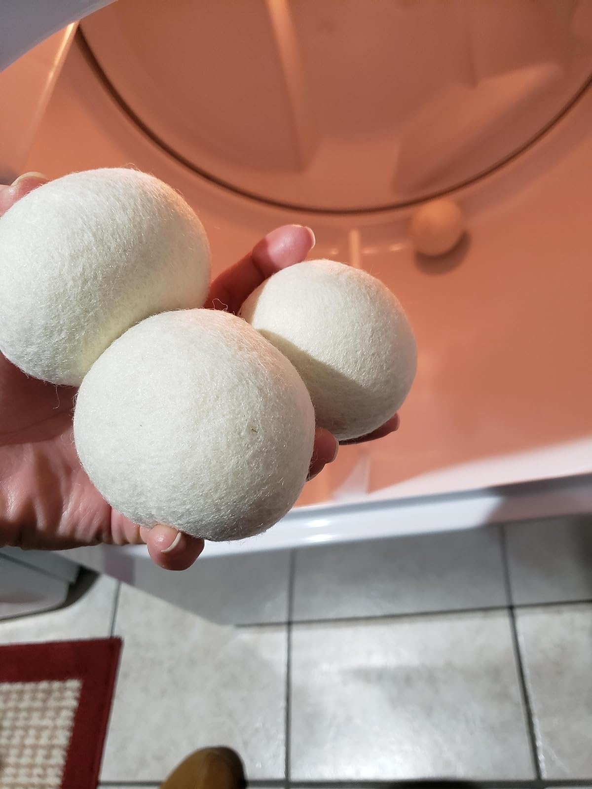 Reviewer holding the dryer balls