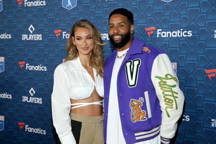 Lauren &#x27;Lolo&#x27; Wood and Odell Beckham Jr. smiling as they stand together for photographers at a media event