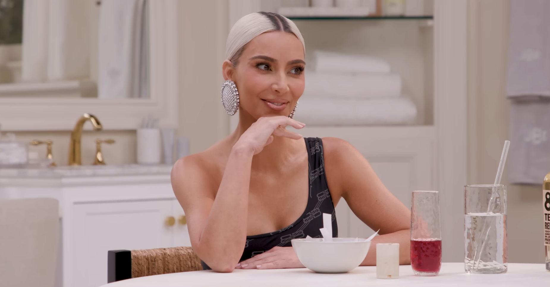 Kim sitting at a dinner table