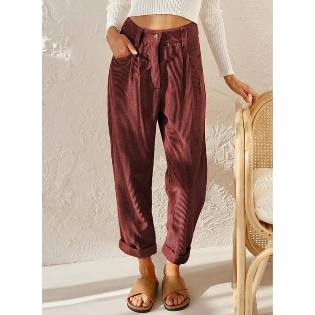 model wearing red corduroy pants with brown sandals
