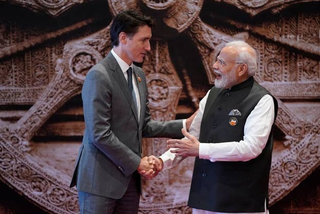 India's Prime Minister Narendra Modi (R) shakes hand with Canada's Prime Minister Justin Trudeau.