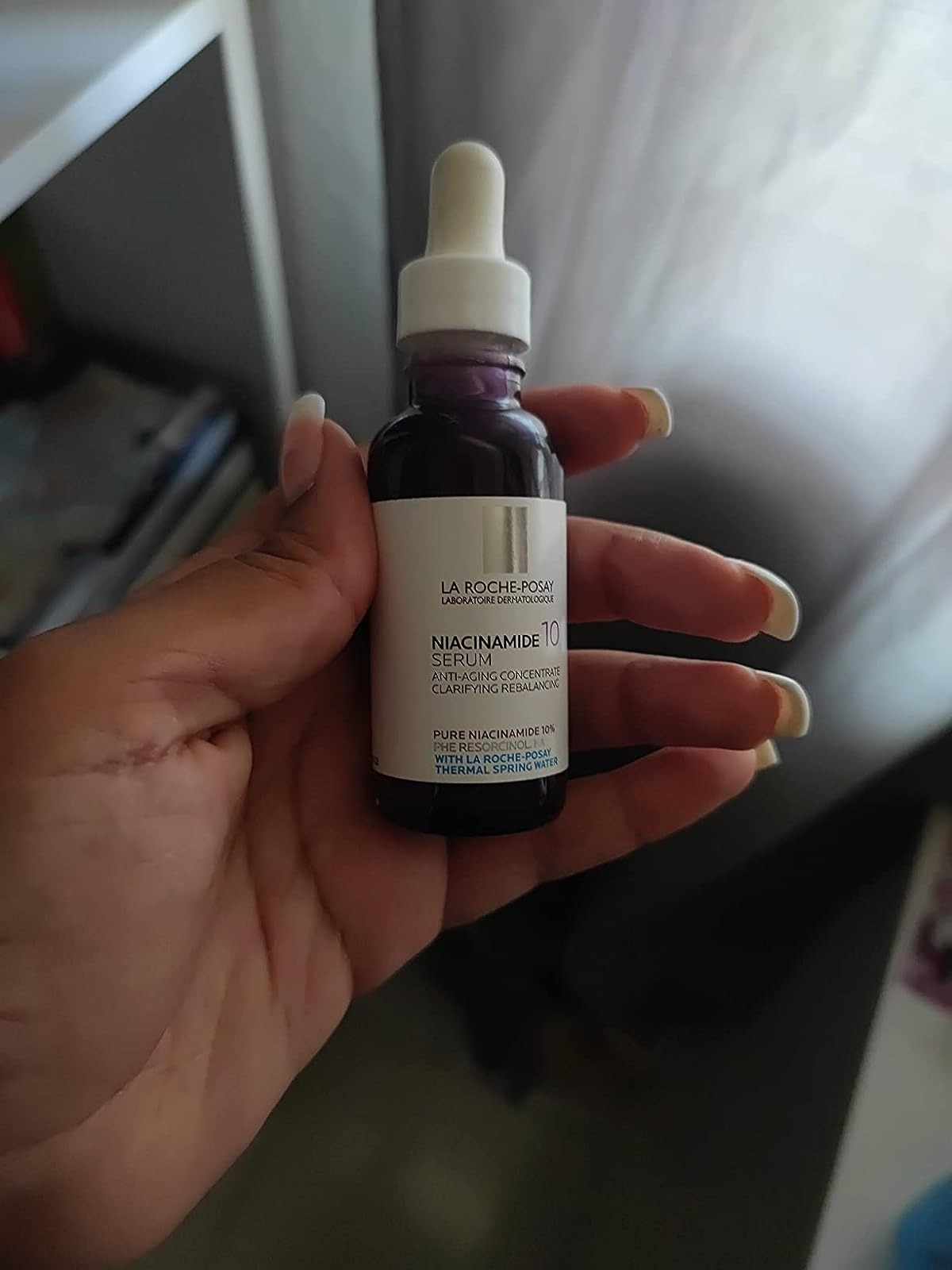 Photo of reviewer holding serum
