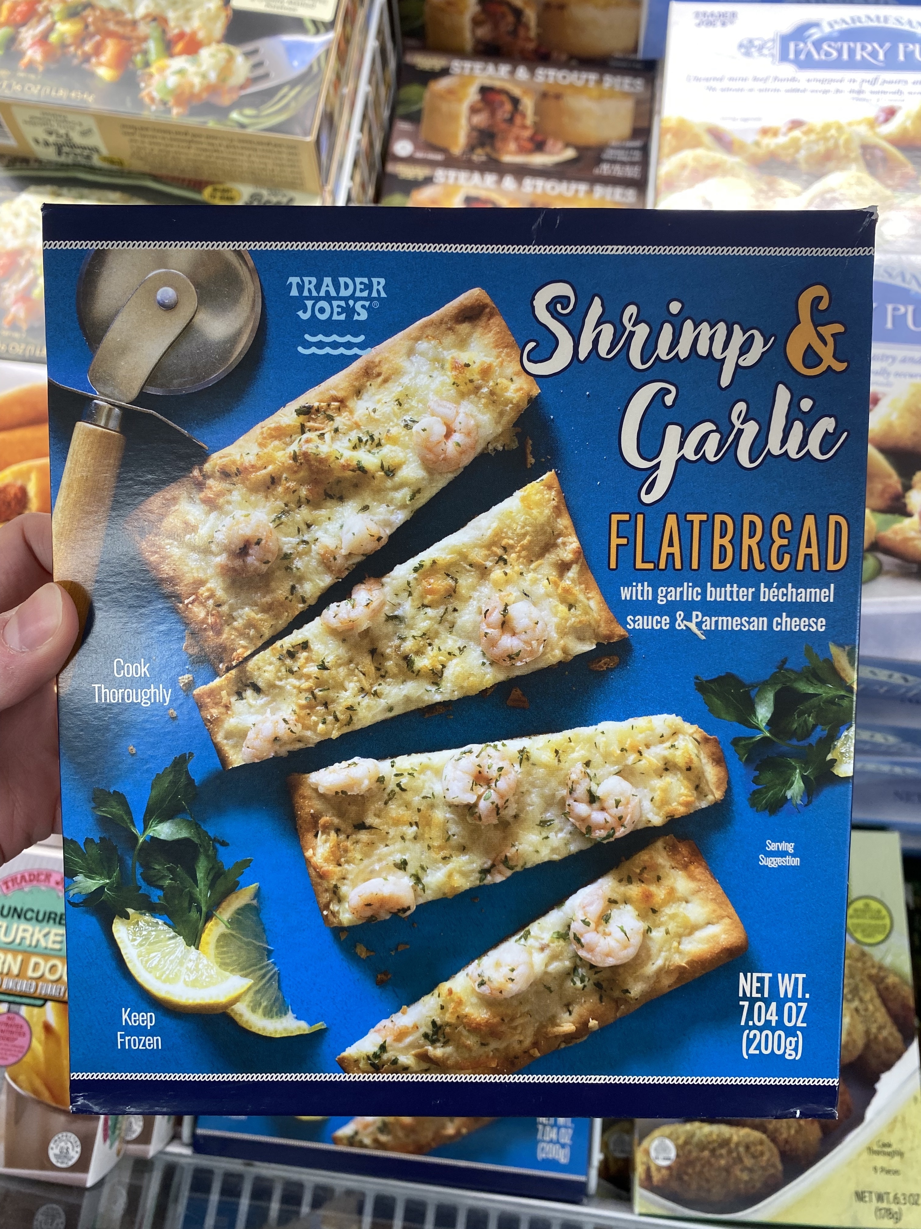 a box of shrimp and garlic flatbread