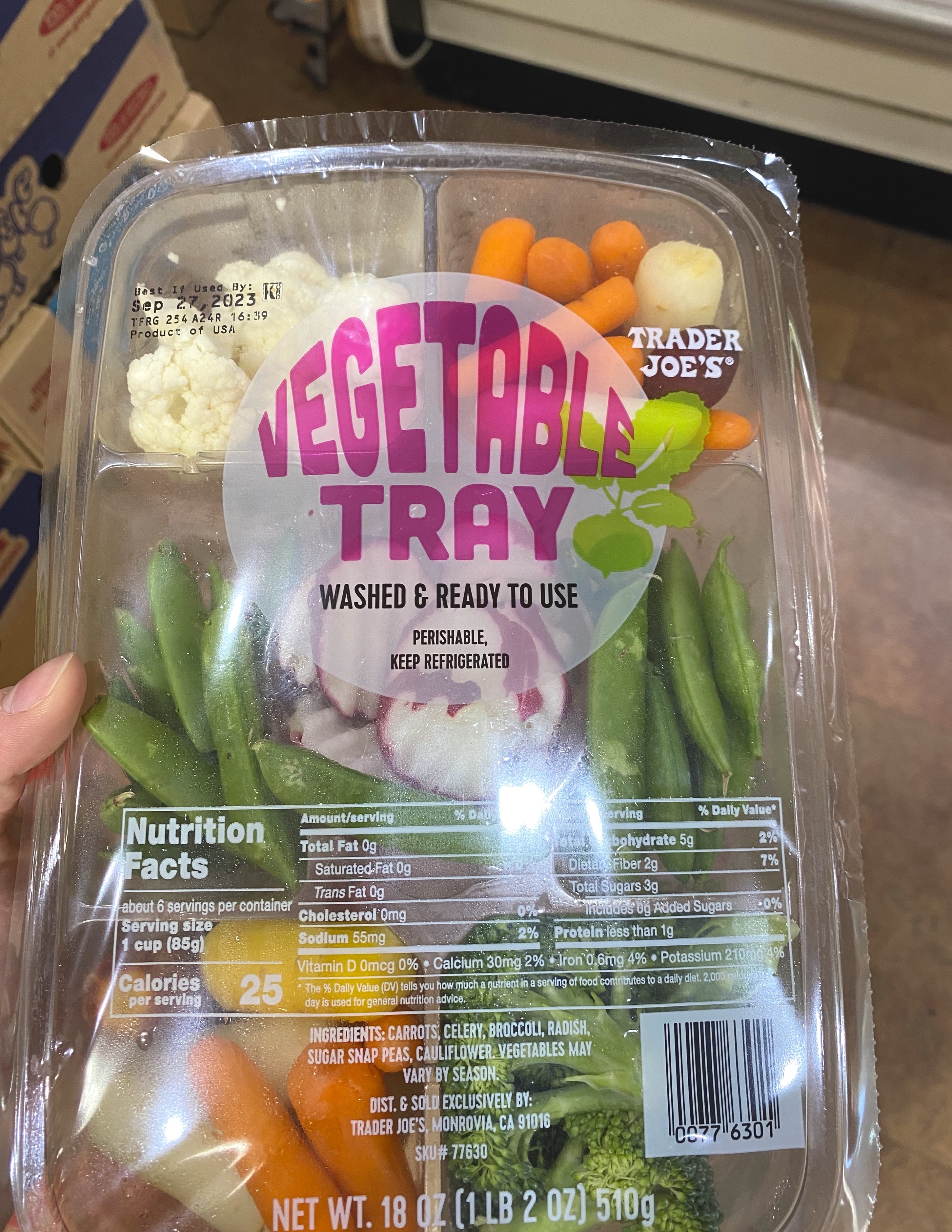 a vegetable tray with several different veggies in their own compartments