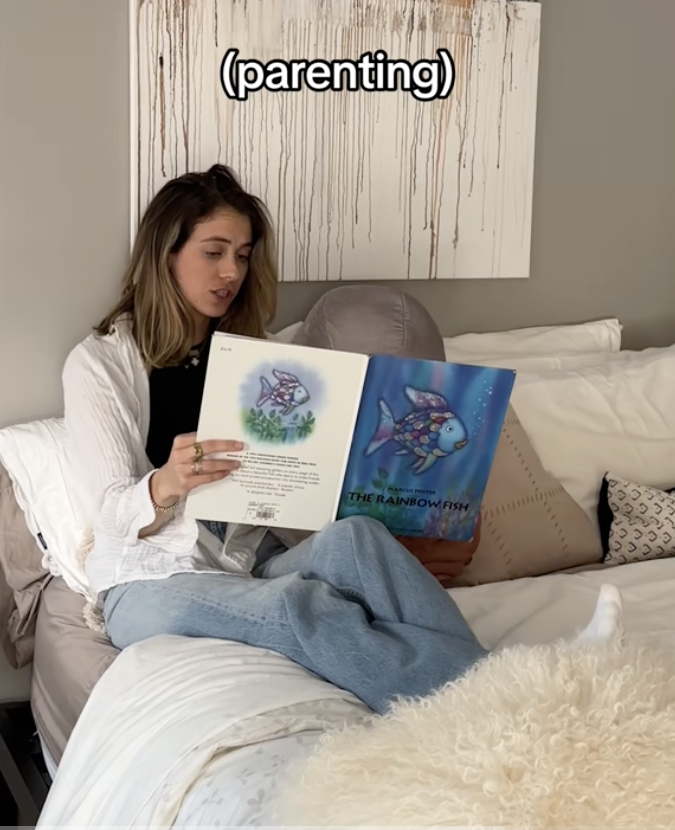 Mom reading a child a book in bed with caption "parenting"