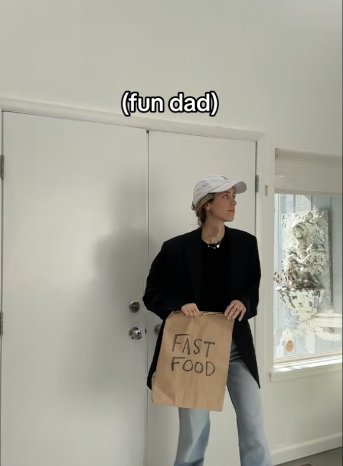 Dad walking into a room holding a fast-food bag with caption &quot;fun dad&quot;