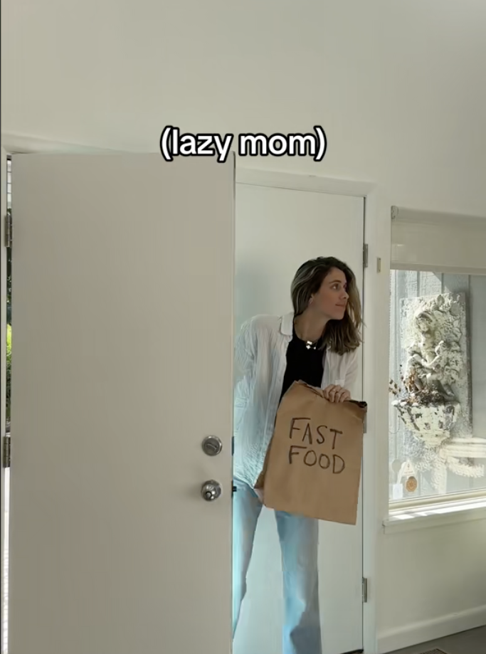Mom walking into a room holding a fast-food bag with caption &quot;lazy mom&quot;