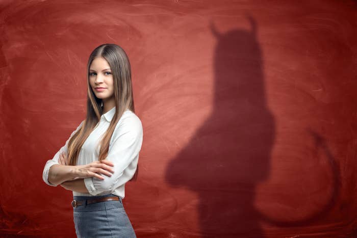 person&#x27;s shadow shows devil horns and tail