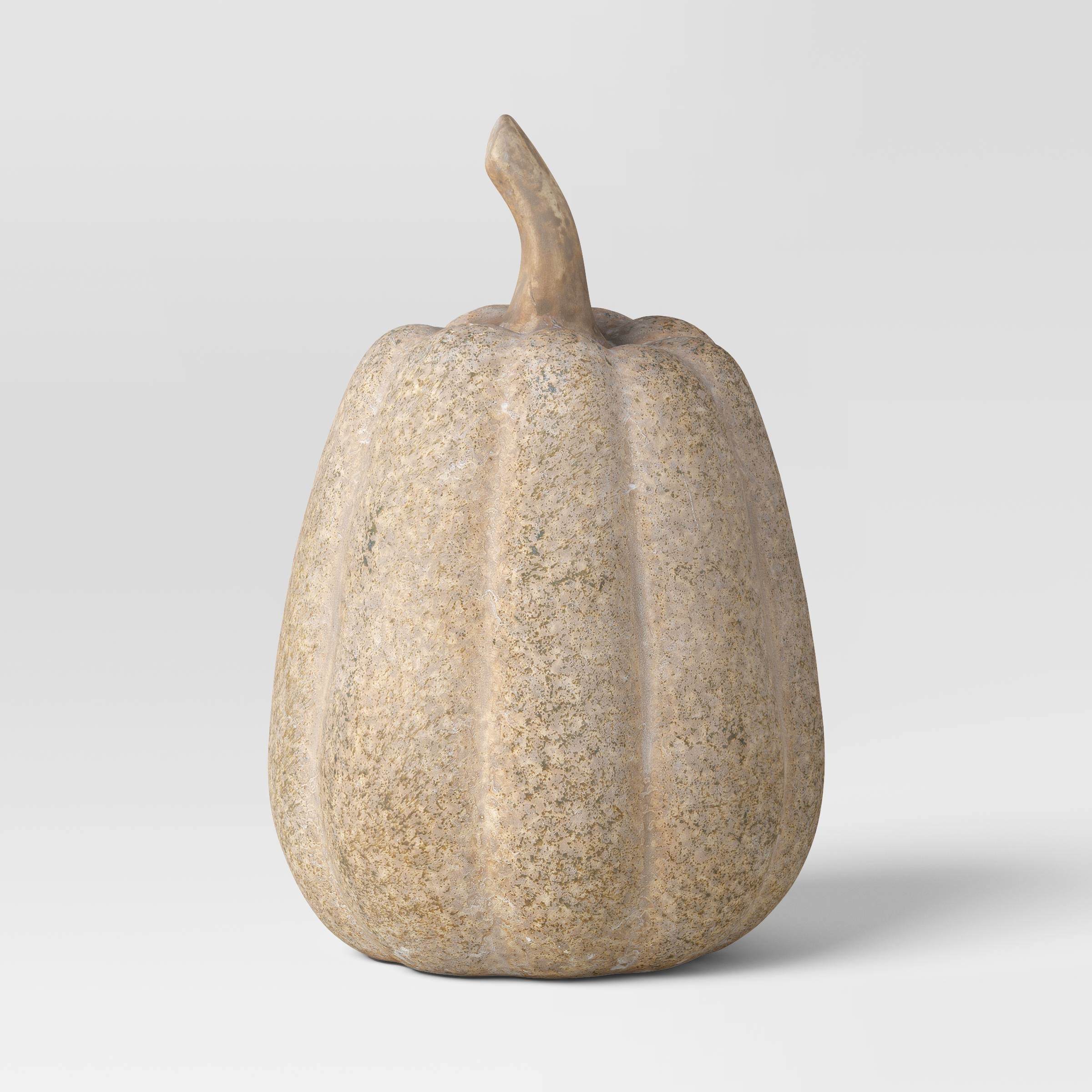 the ceramic pumpkin with an oblong shape and speckled finish