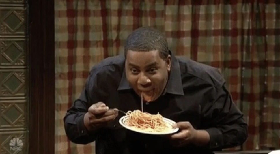 person eating pasta and stop mid-bit