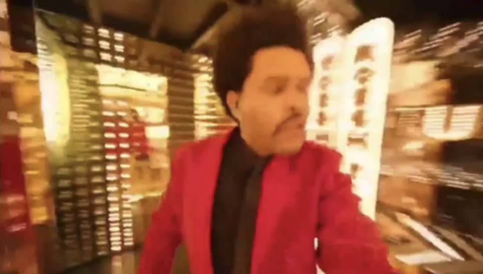 blurry photo of the weeknd in his music video