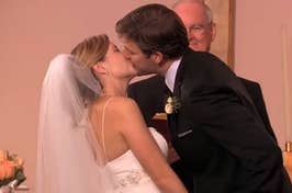 Jim and Pam from The Office kissing on their wedding day