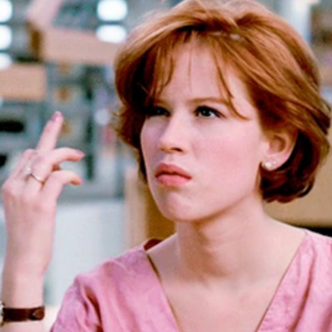 Molly Ringwald in &quot;The Breakfast Club&quot; flipping someone off