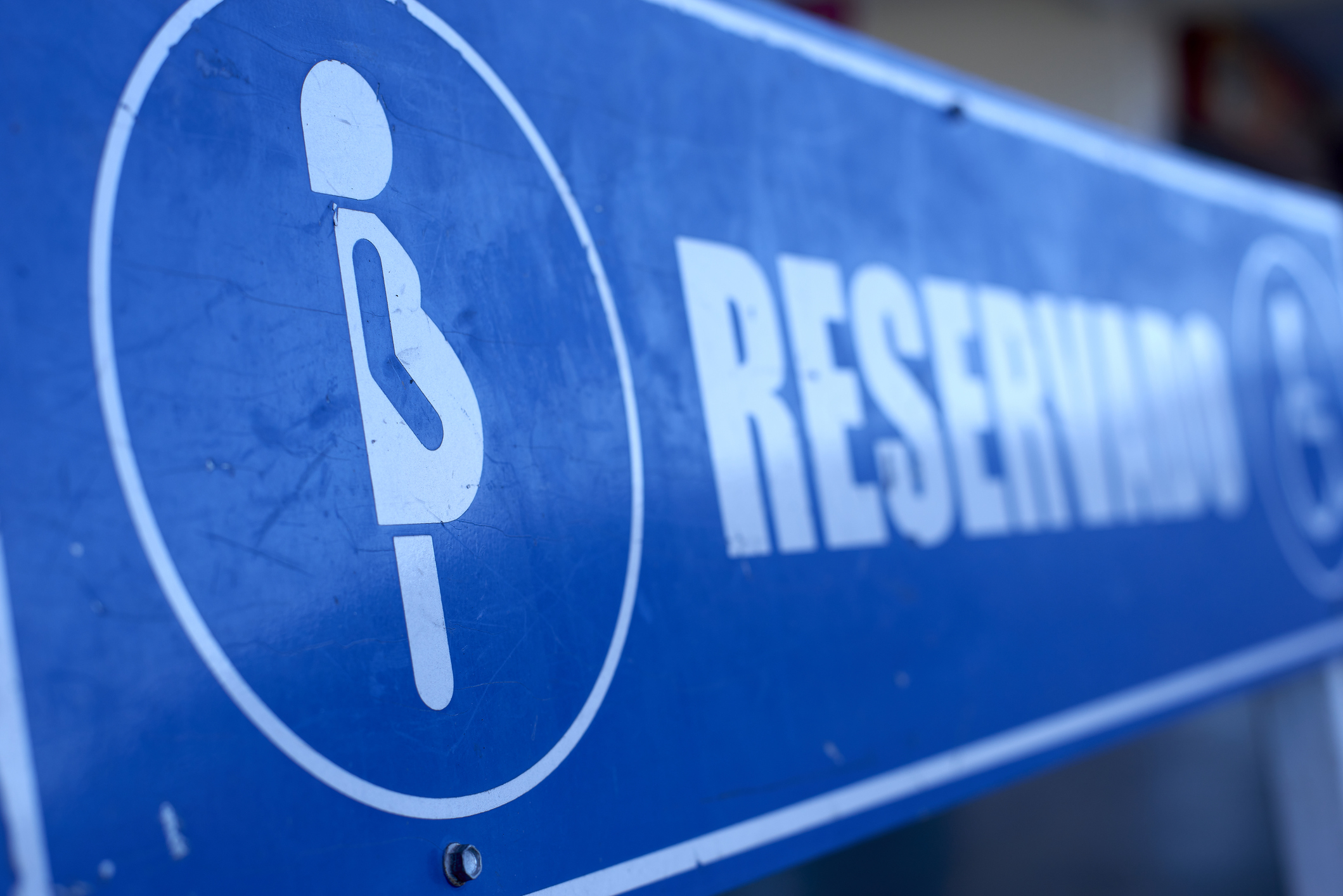 a parking sign with an image of a pregnant person