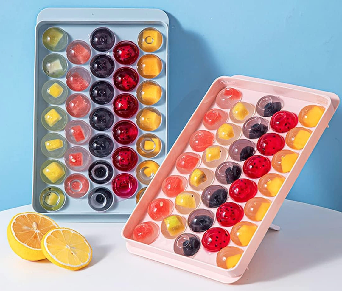 round ice trays filled with fruit-infused ice balls