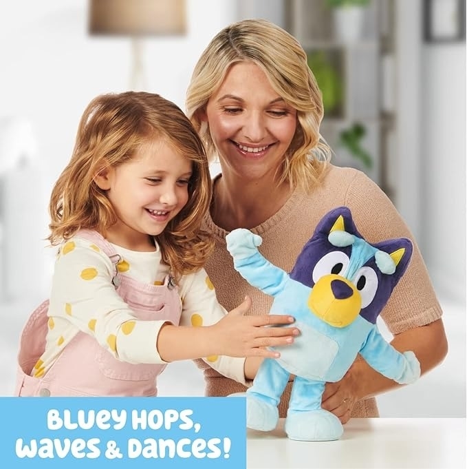 Woman and child play with a Bluey toy. Text reads Bluey hopes, waves, and dances