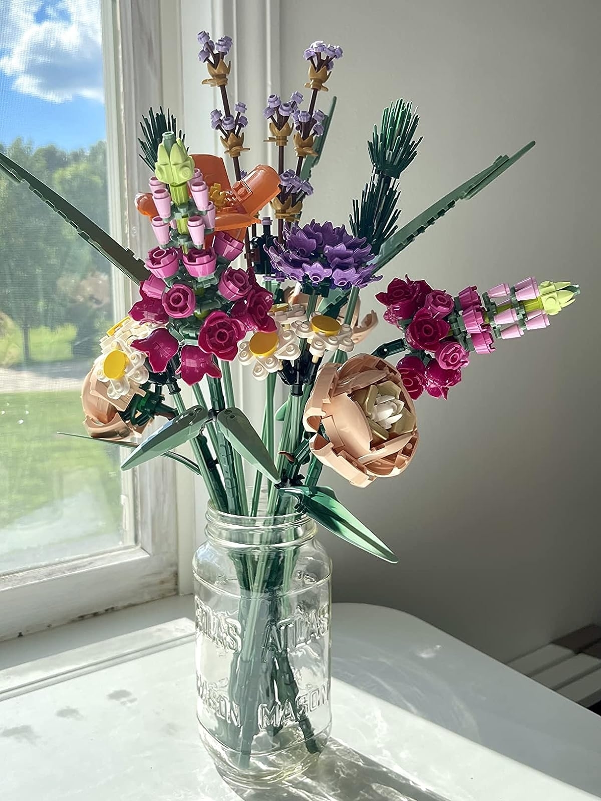 Reviewer&#x27;s photo of the Lego bouquet in a vase