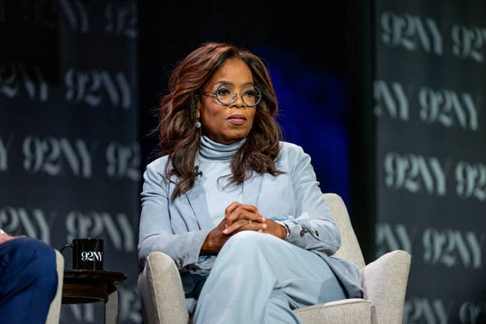 Close-up of Oprah sitting onstage