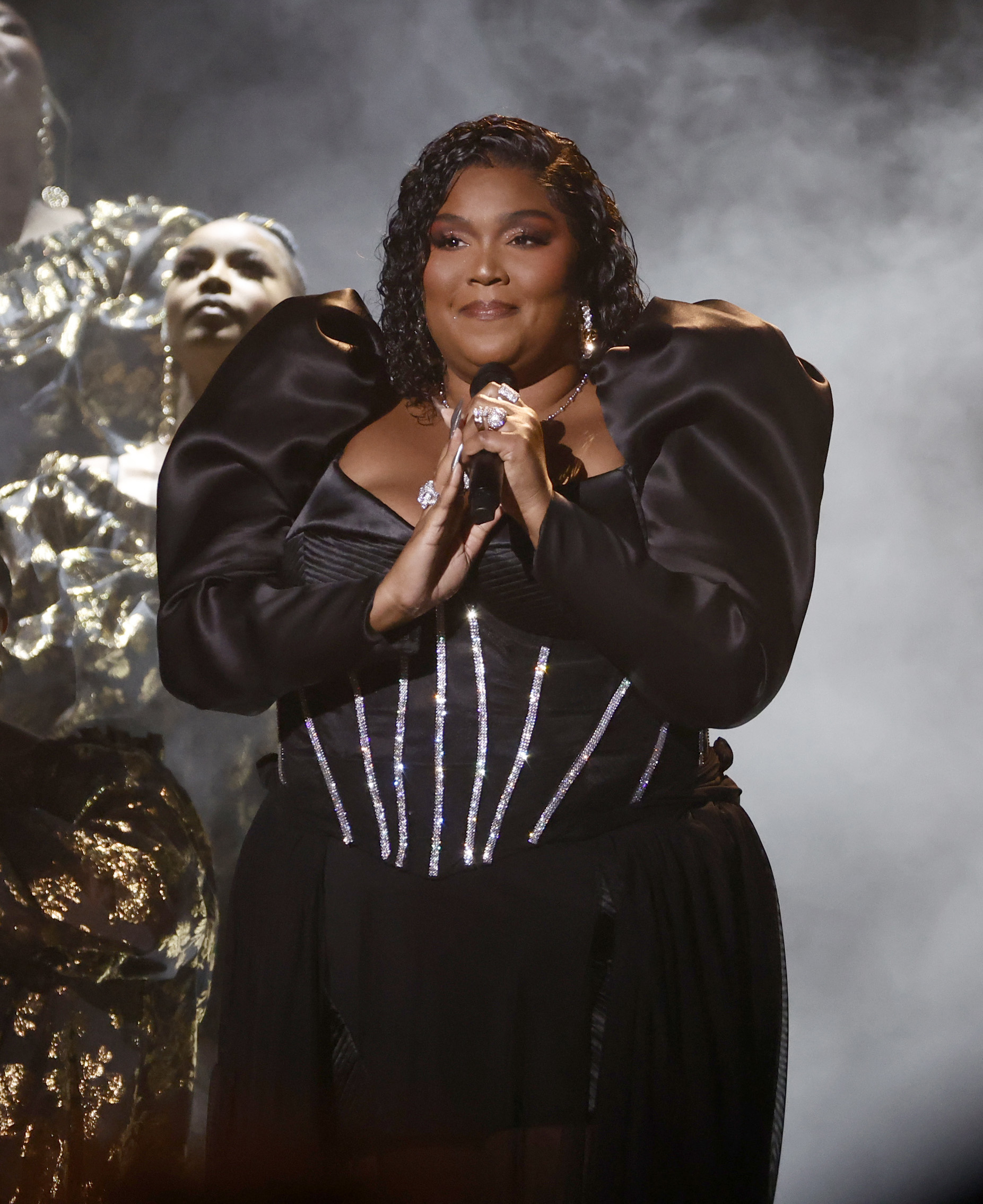 Lizzo hit with a brand new lawsuit about bullying by her touring