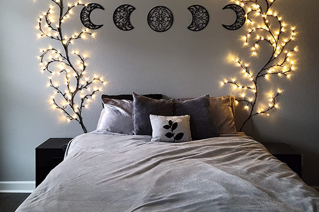 reviewer's bed with two glowing tree vines on either side of the wall 