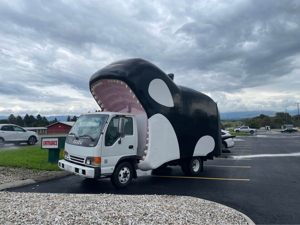 A truck that looks like an orca is about to swallow it