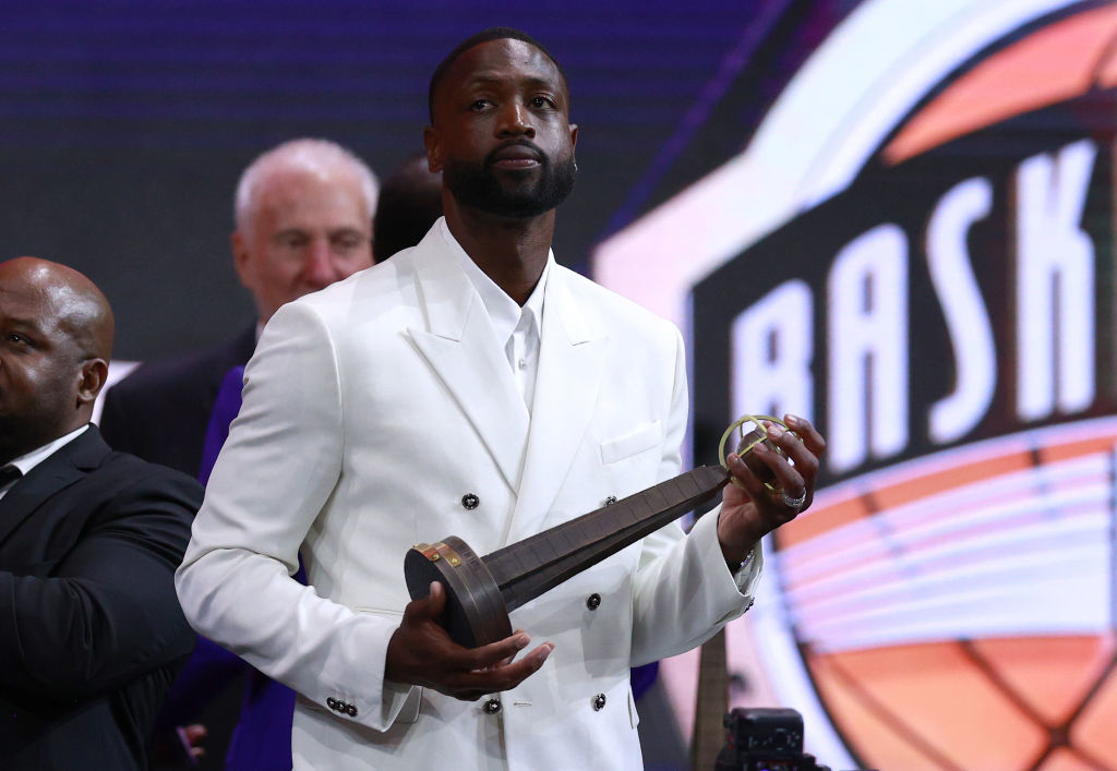 Closeup of Dwyane holding an award