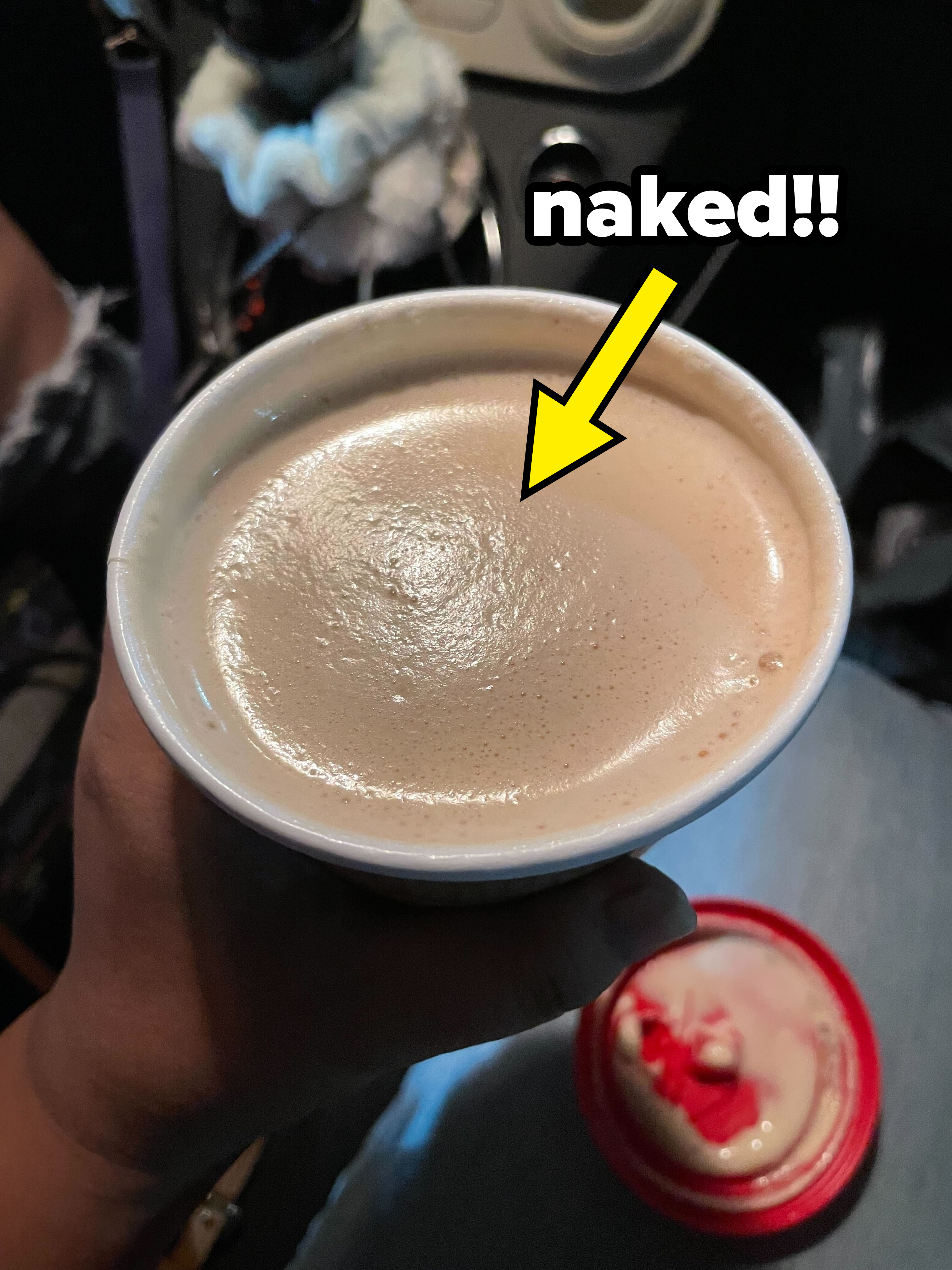 The Krispy Kreme coffee is being shown while the caption &quot;naked!!&quot;
