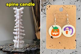 L: white candle shaped like a spine R: earrings that look like Pillsbury sugar cookies with a pumpkin and ghost one them