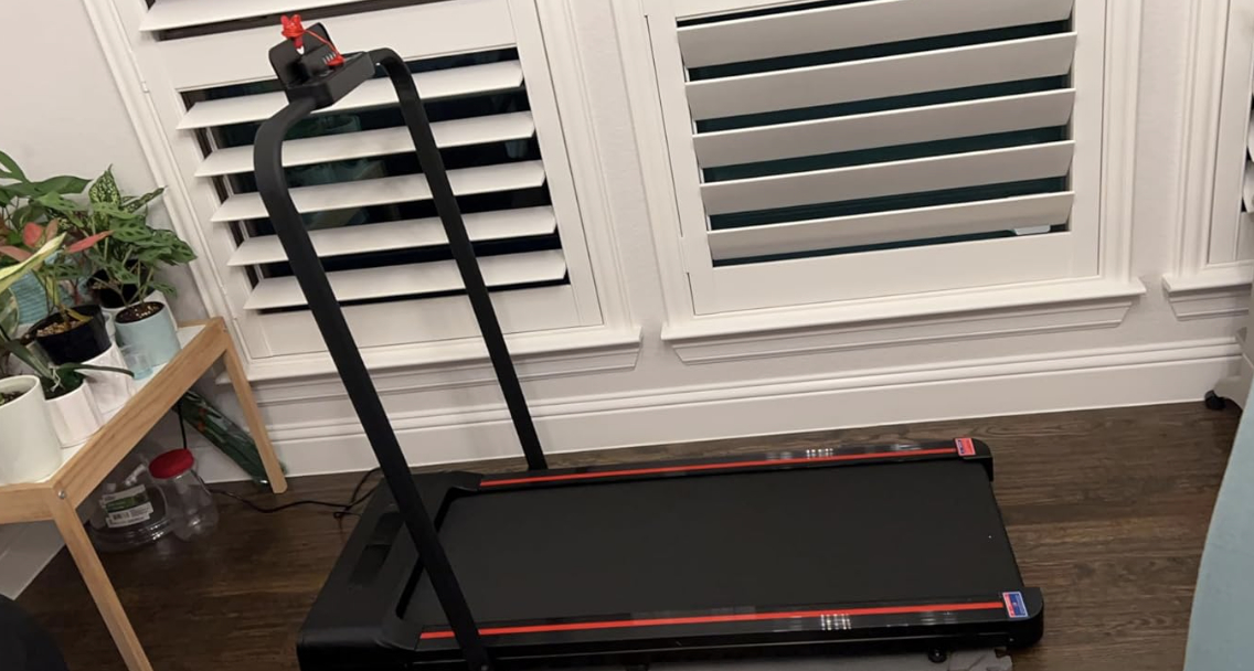 reviewer photo showing the compact treadmill