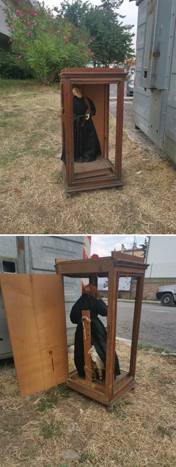 a creepy doll in a wooden frame