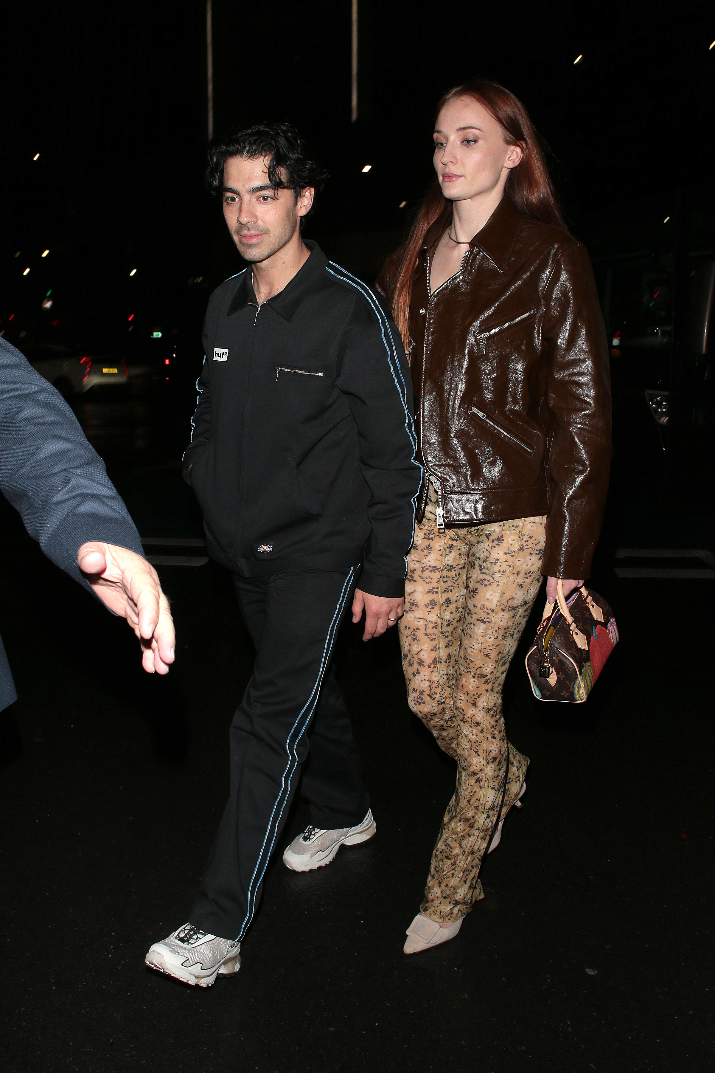 Close-up of Joe and Sophie walking together