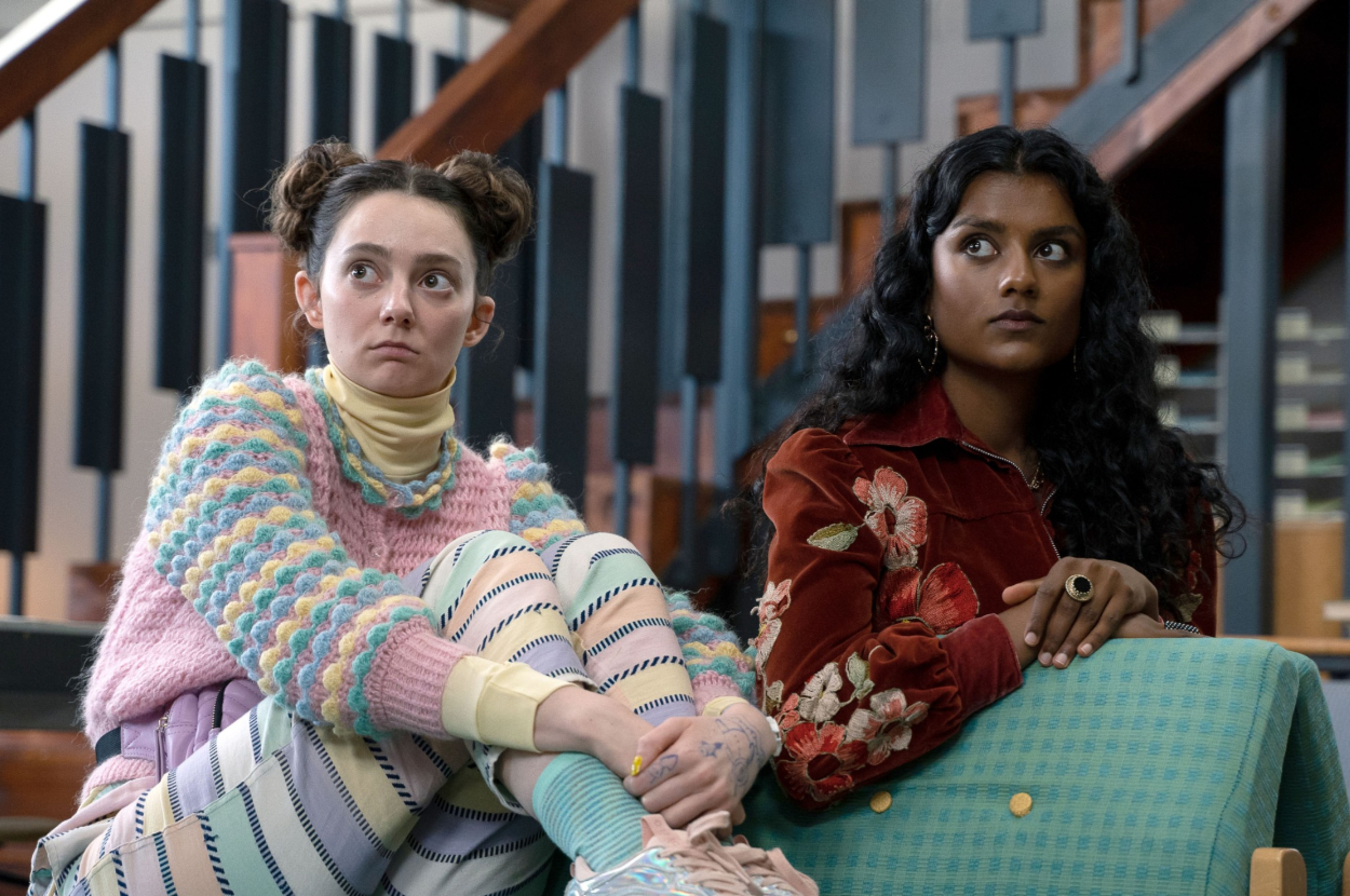 a london telephone booth on the left and maeve on the right