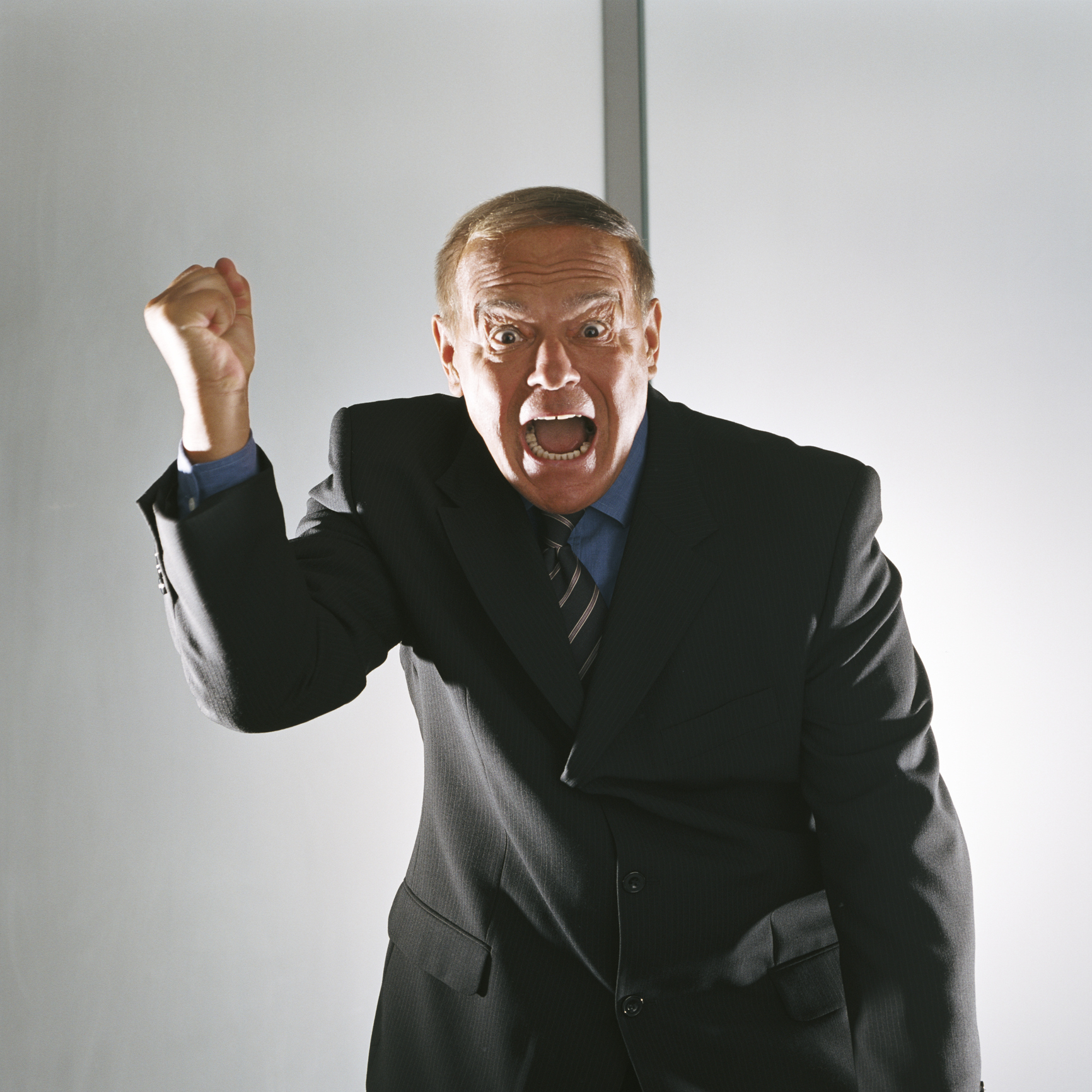 man in a suit yelling