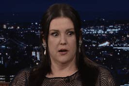 Melanie Lynskey has wide eyes and an open mouth as if shocked