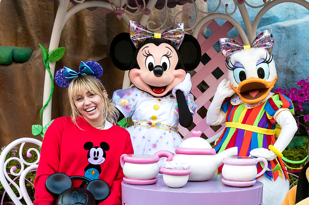 Miley Cyrus with Minnie Mouse.