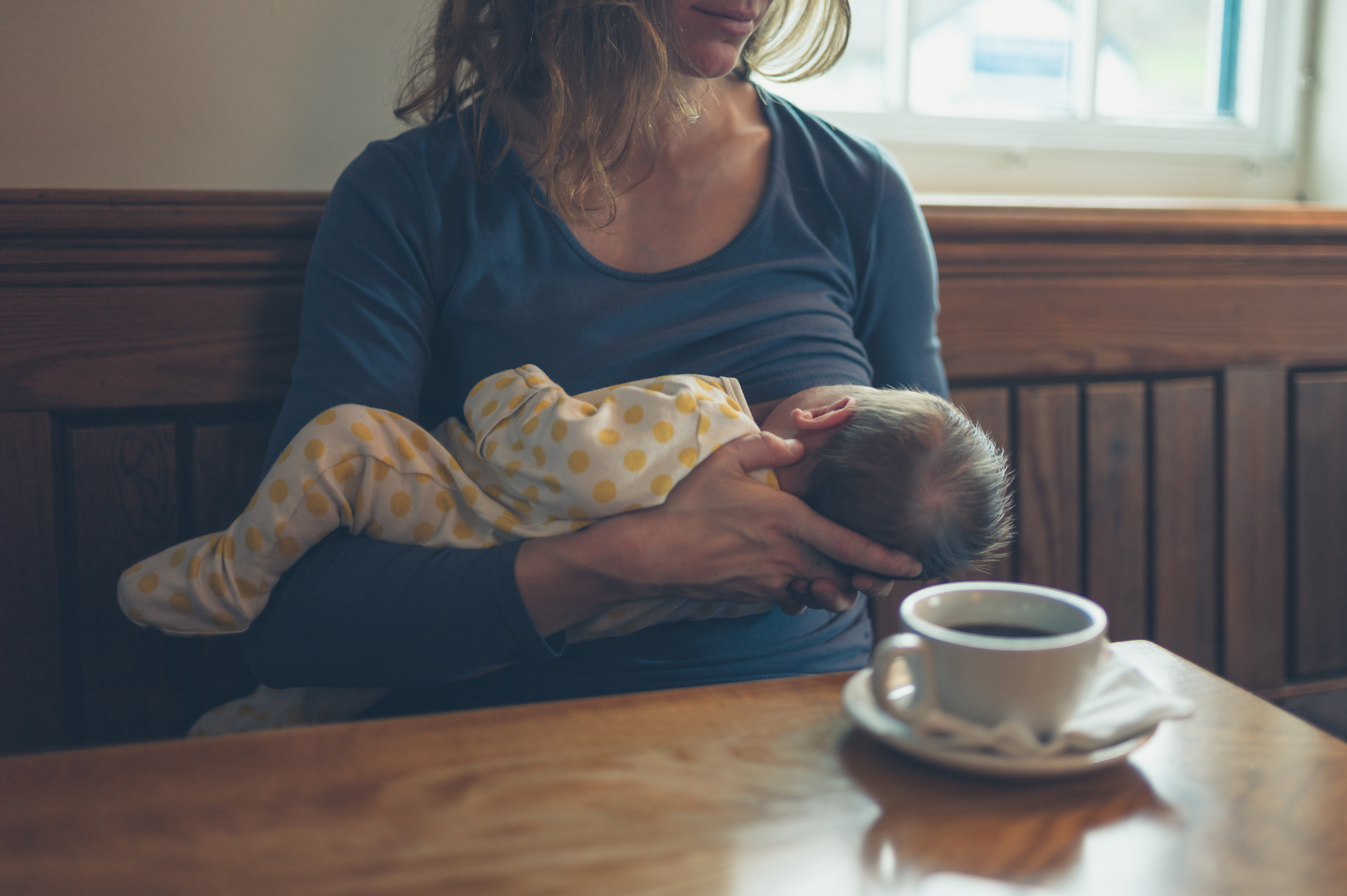 a mom breastfeeding in public