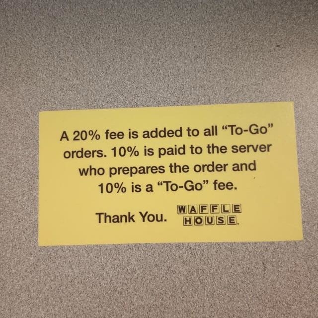 A Waffle House sign says there will be a 20% fee on all to-go orders — 10% will go to the server, and 10% is a &quot;to-go fee&quot;
