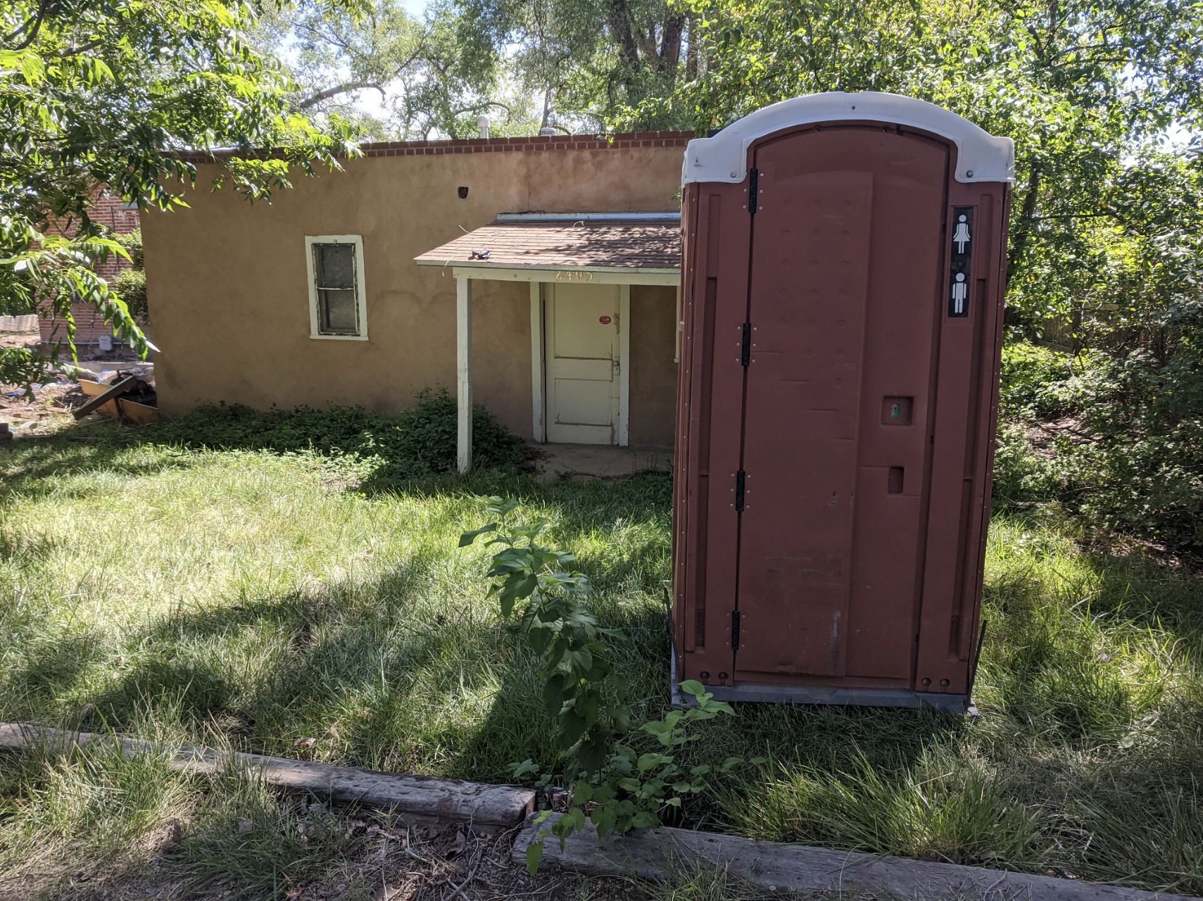 a port-a-potty in the backyard