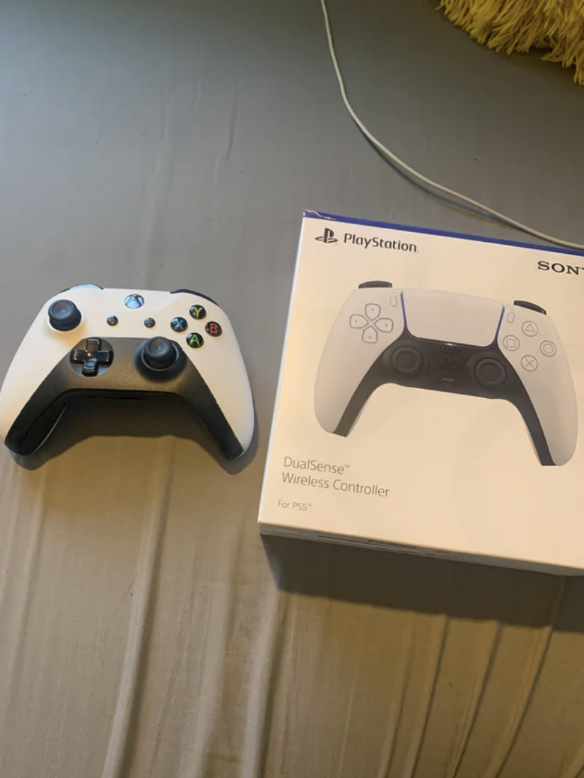 The Xbox controller next to the PlayStation controller box