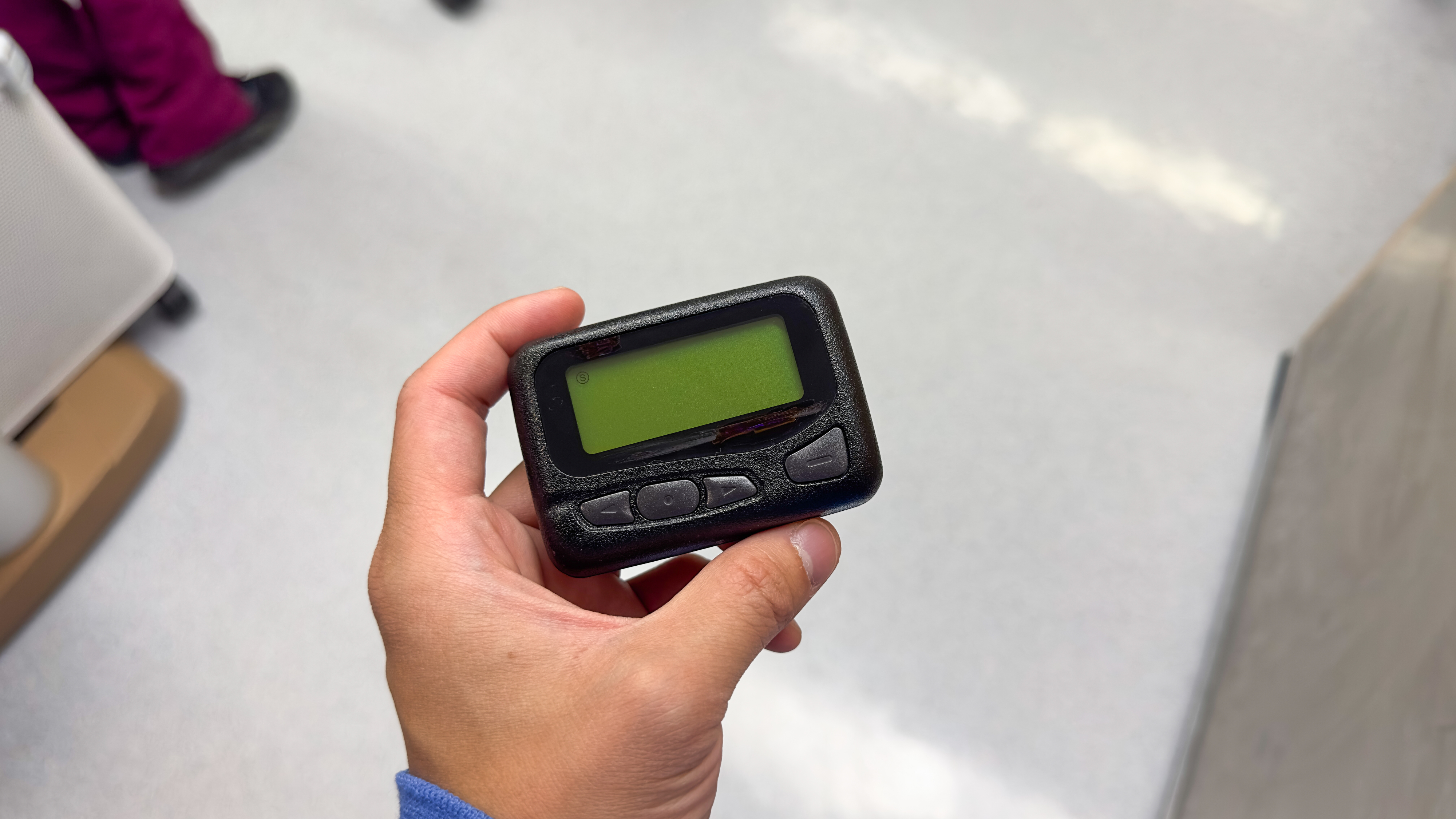 someone holding a pager