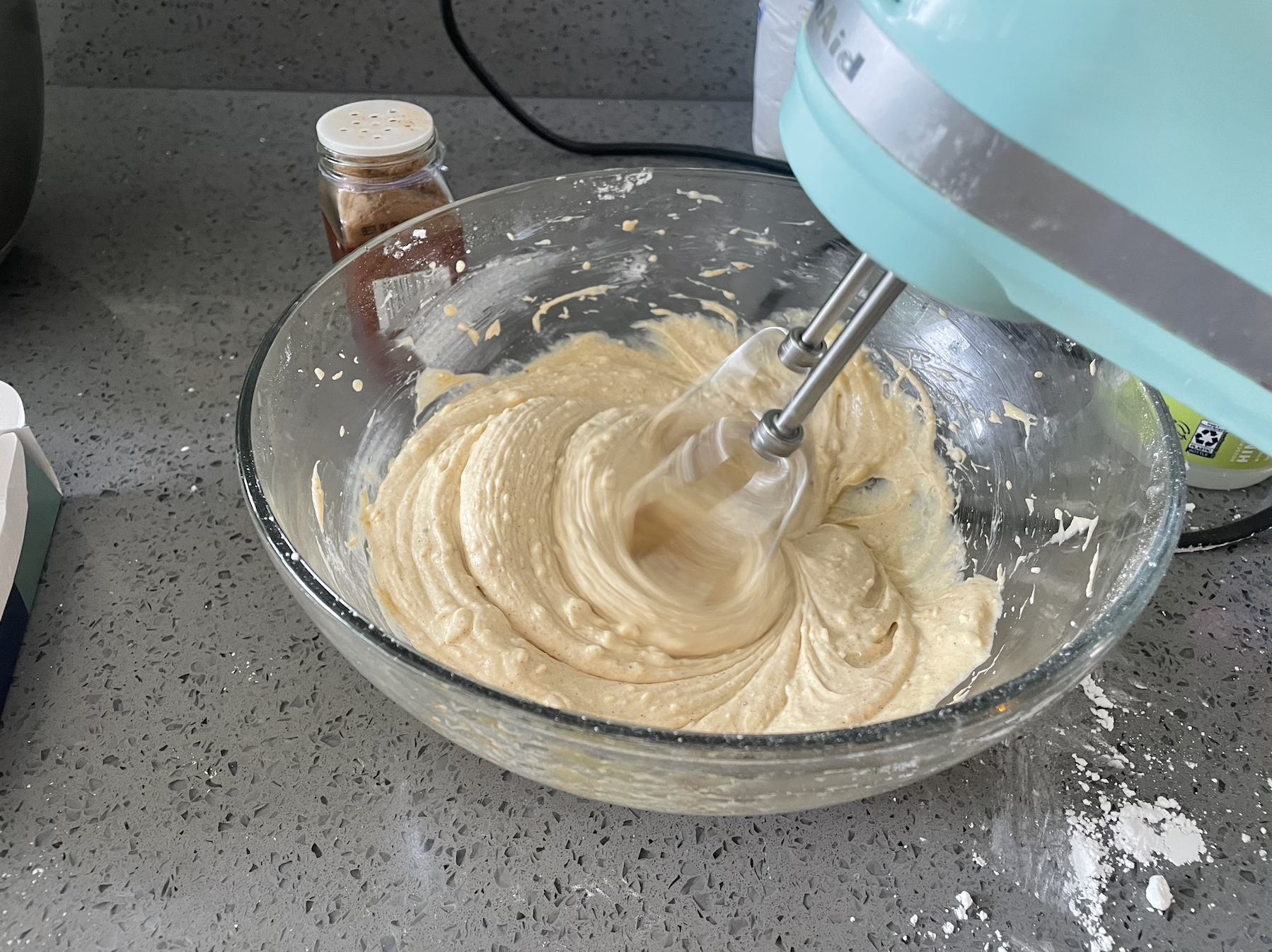 my hand mixer violently whipping frosting ingredients together