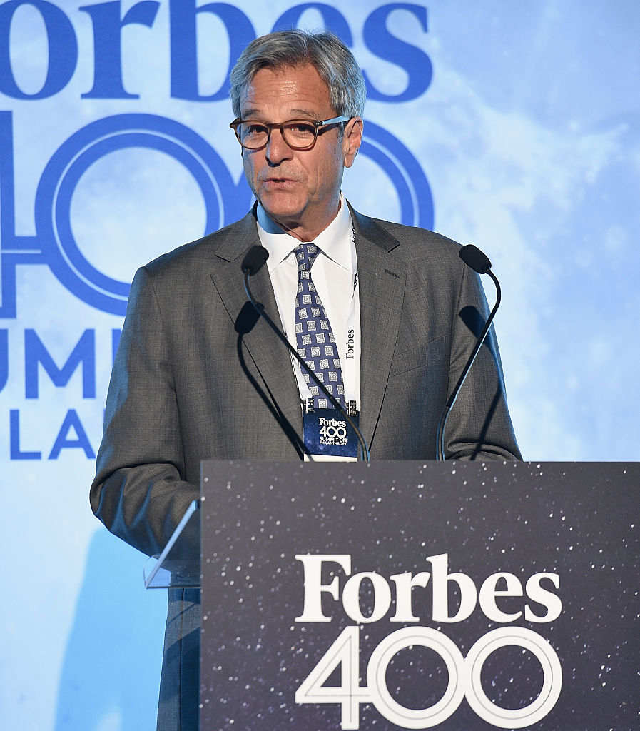 person speaking at a forbes 400 event