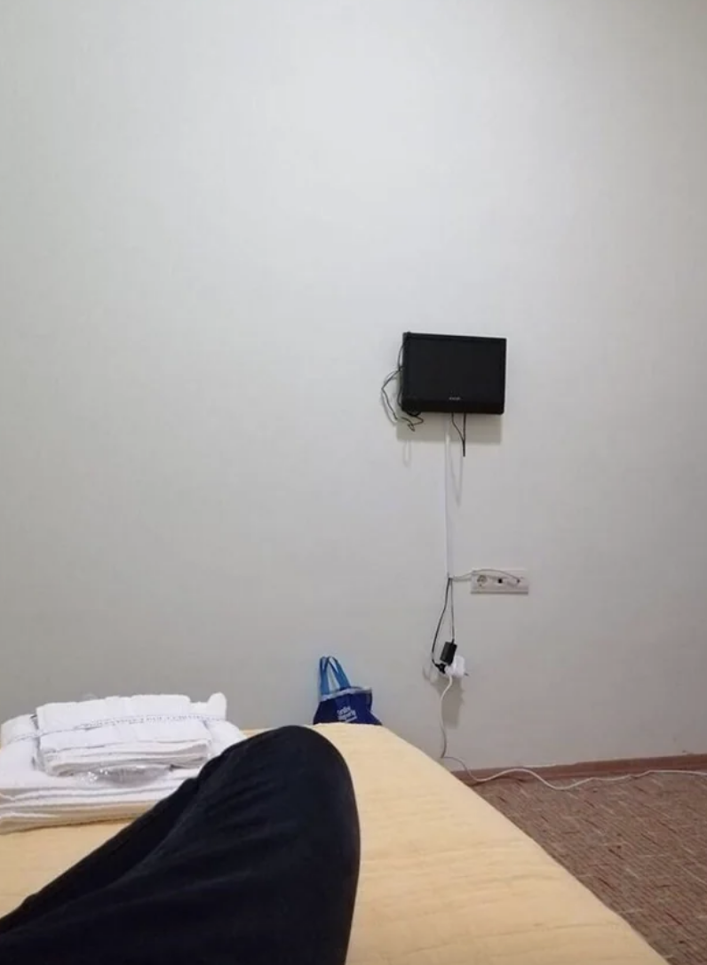 a very small tv on the wall