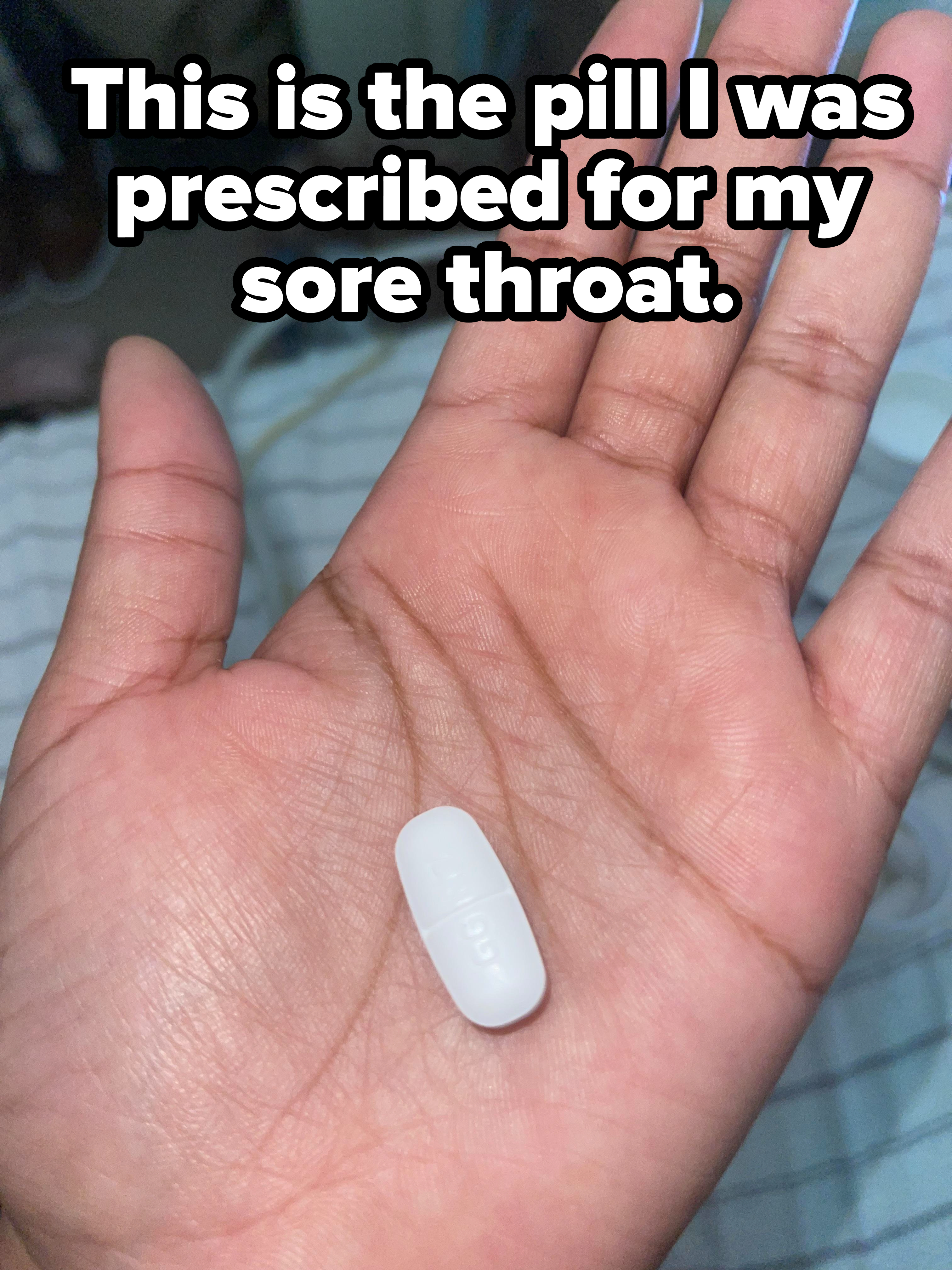 A huge pill in the palm of a hand with caption &quot;This is the pill I was prescribed for my sore throat&quot;