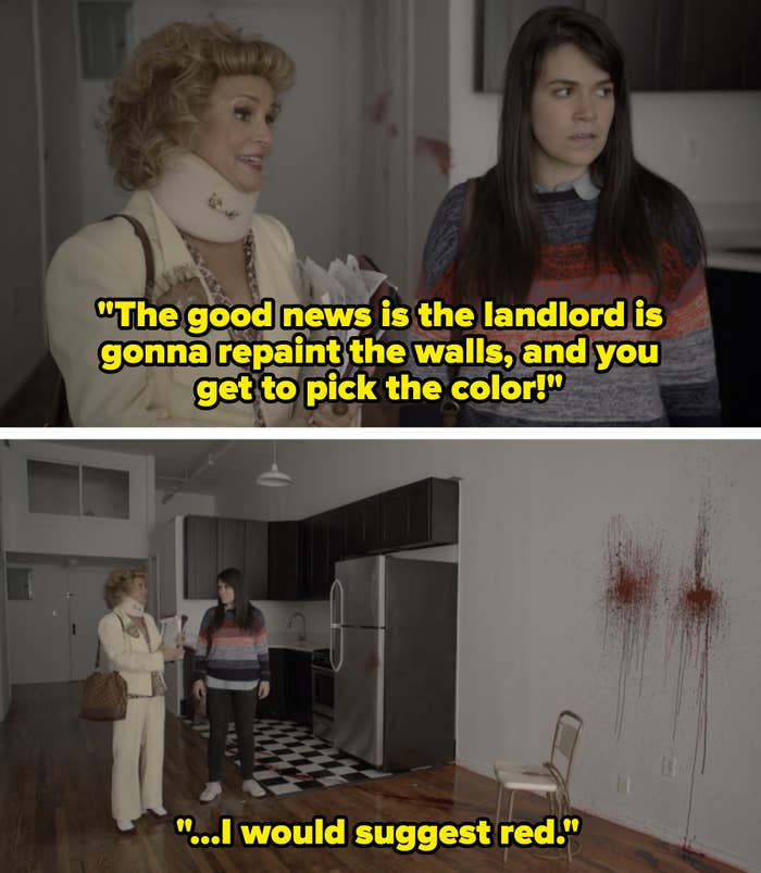 real estate agent showing a person an apartment with blood splattered on the wall