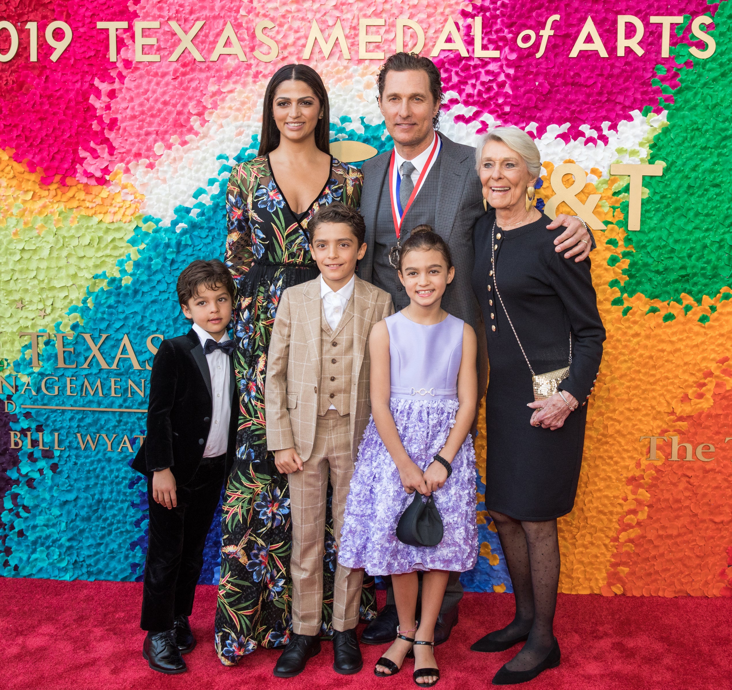 Close-up of Camila and Matthew on the red carpet with their family