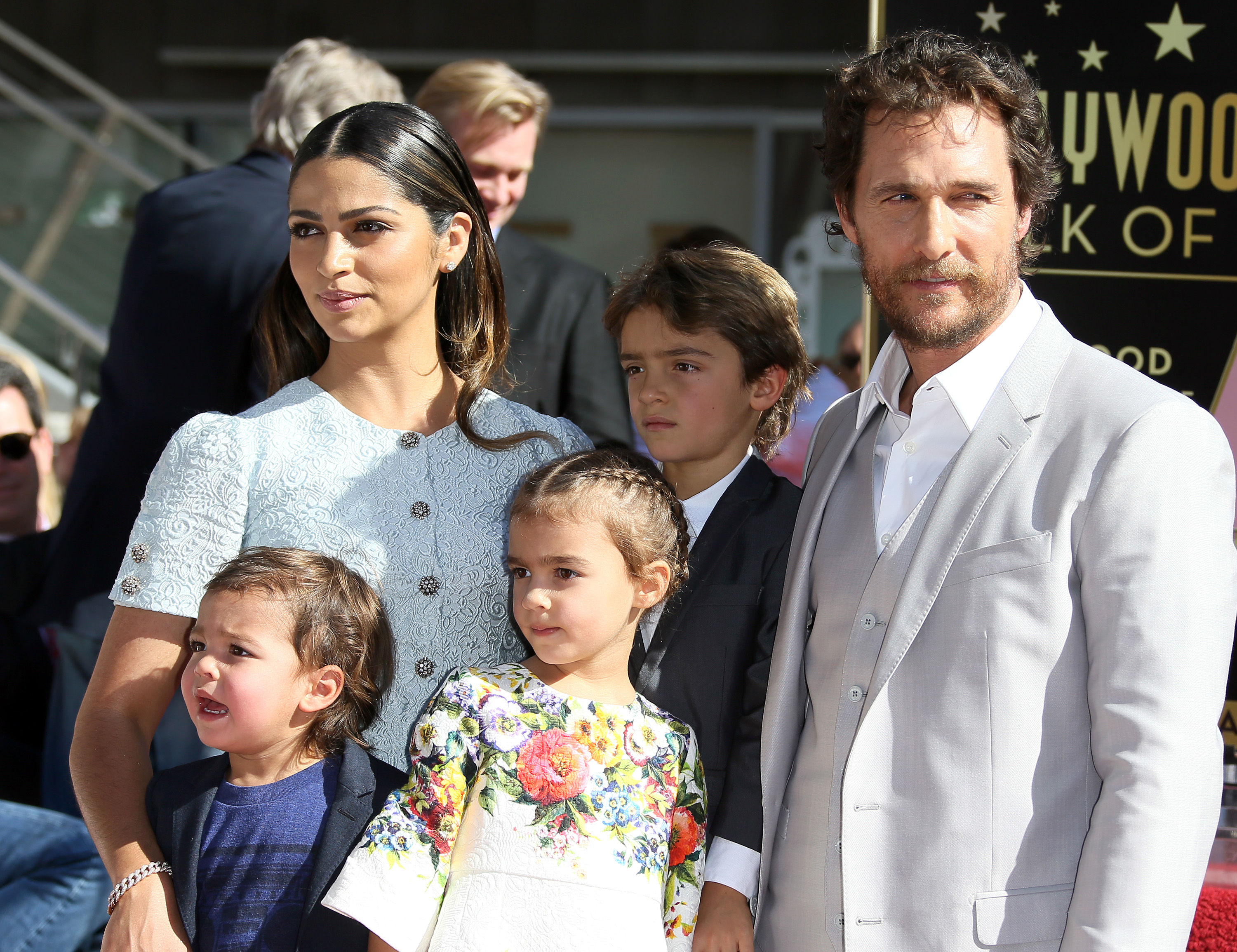 Close-up of Camila, Matthew, and their children on the red carpet