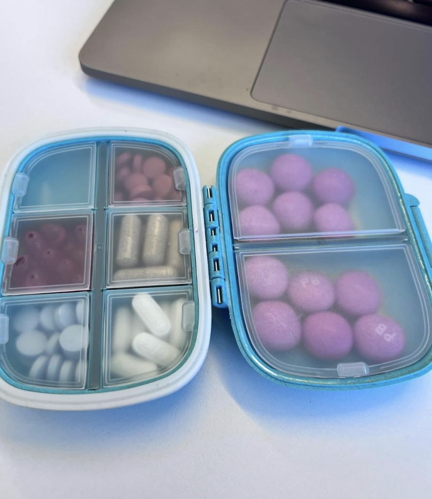 portable blue pill box with clear compartments